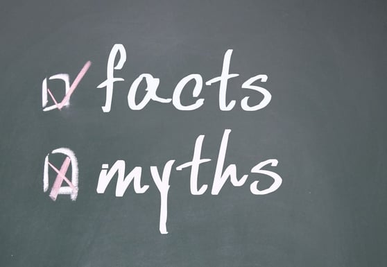 Blackboard with facts and myths written on it