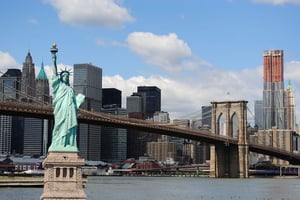 The landmark Statue of Liberty against the impressive New York City skyline.